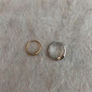 Silver dolphin ring and gold heart ring